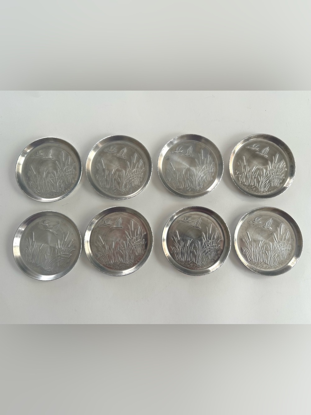 Vintage Aluminum Coasters Set of 8 Flying Duck Embossed Silver Tone Metal Home
